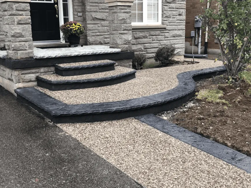 Exposed aggregate front entrance with dark decorative borders