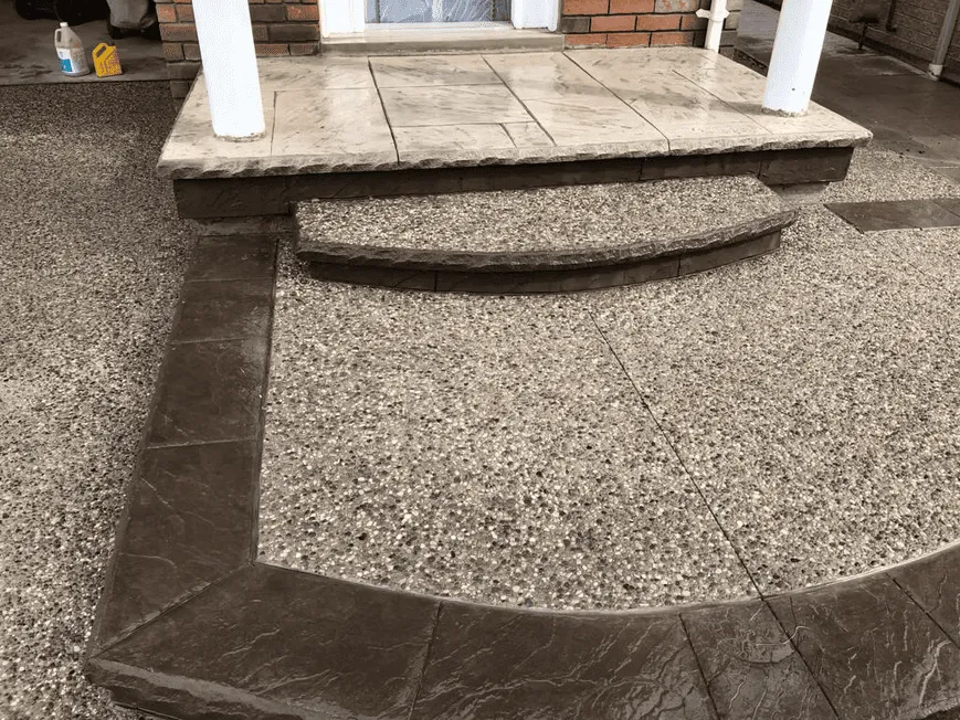 Curved exposed aggregate porch and front steps