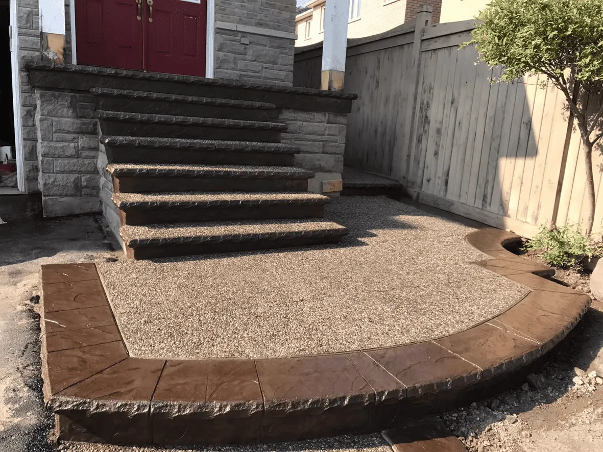 Exposed aggregate front porch and steps with a coloured border