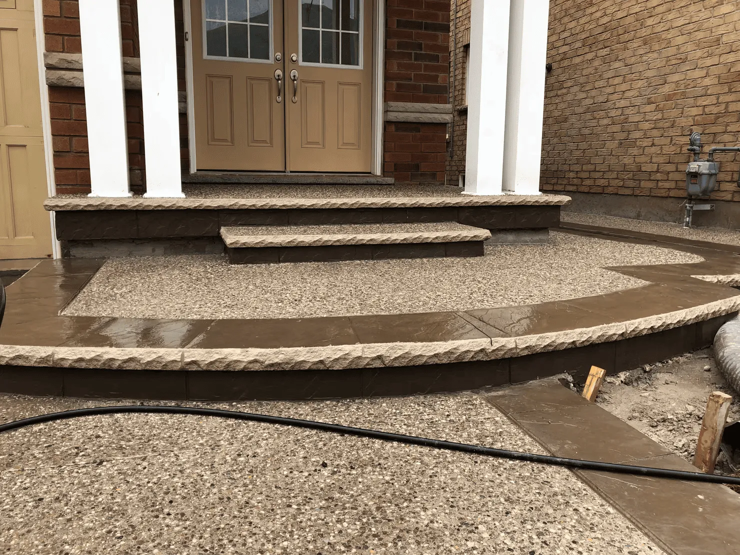 Exposed aggregate porch, steps and curved lower landing
