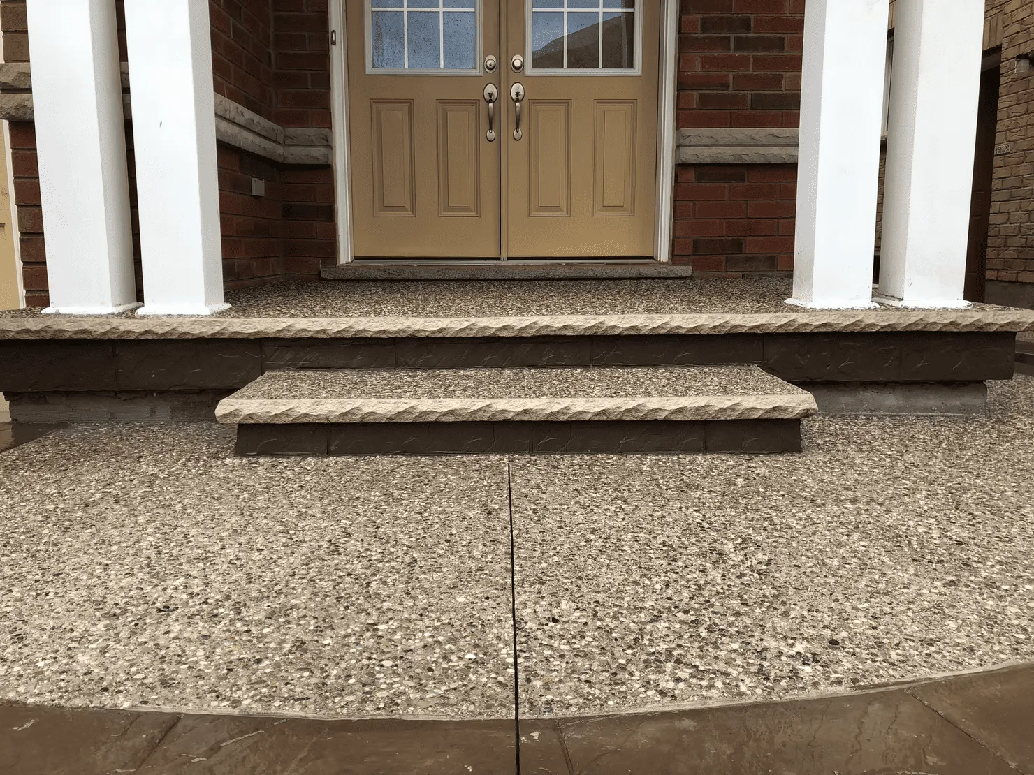 Wide exposed aggregate porch and front steps