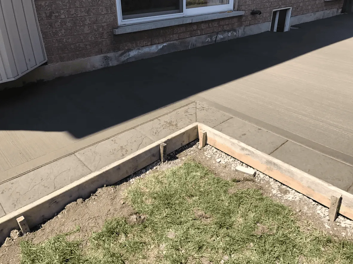 Plain concrete patio with a contrasting border