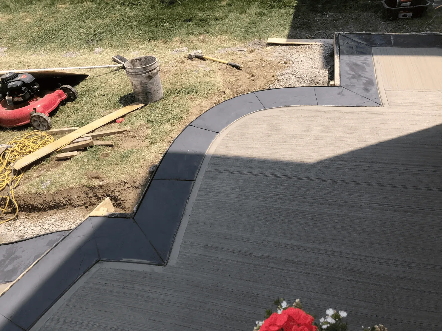 Finished plain concrete curved patio and border