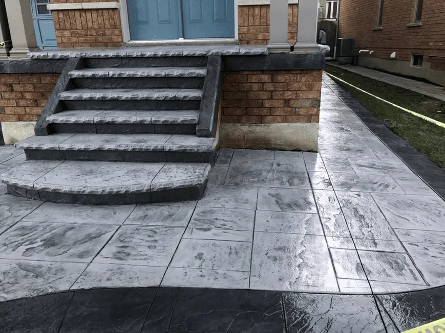Stamped concrete porch and steps at a home entrance