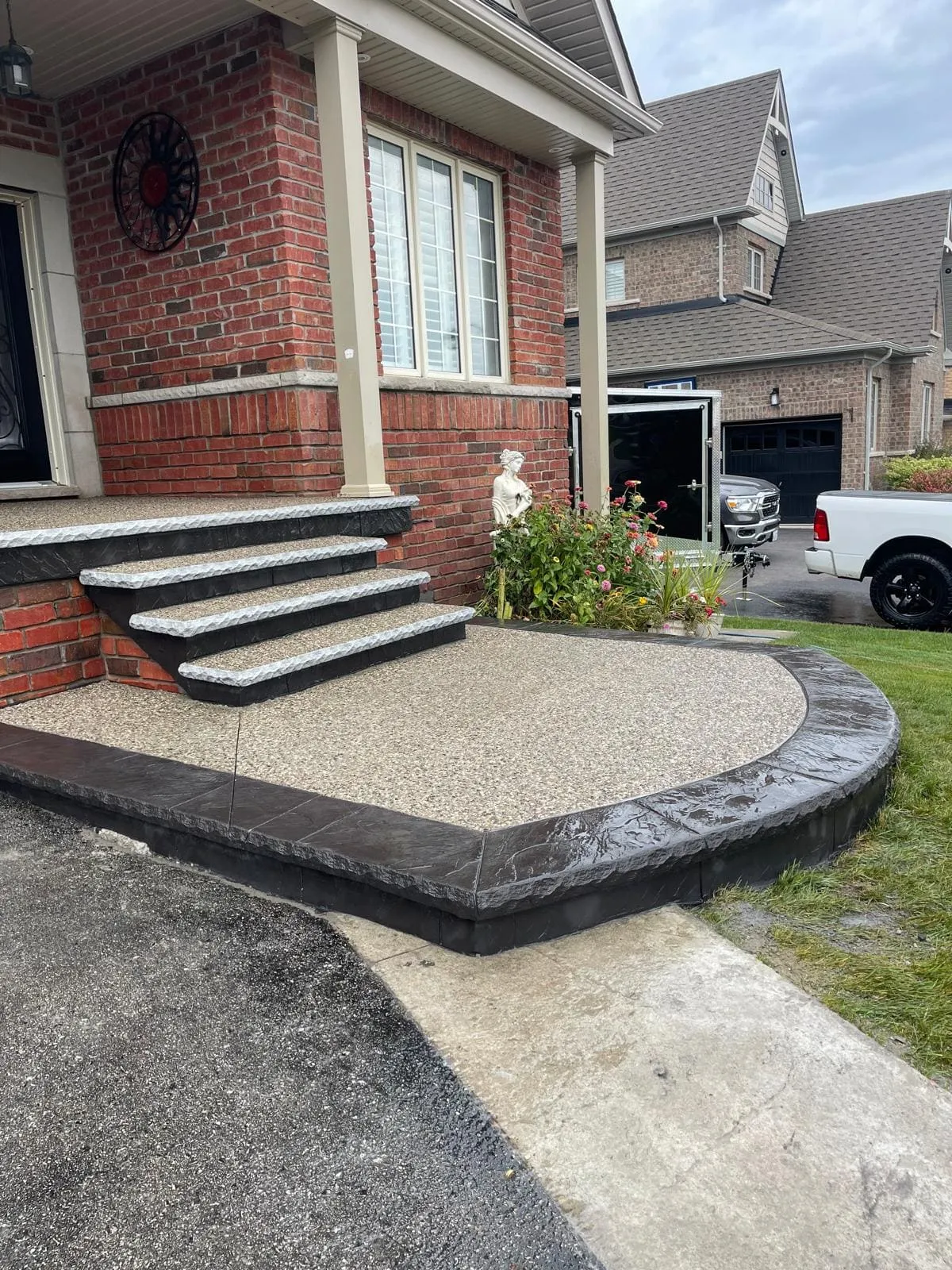 Curved exposed aggregate front entrance and walkway