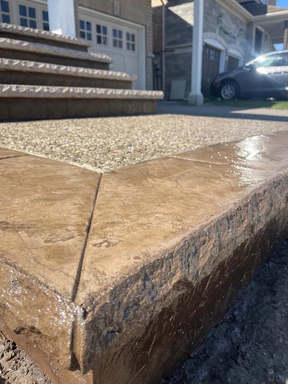 Close view of an exposed aggregate corner and accent border