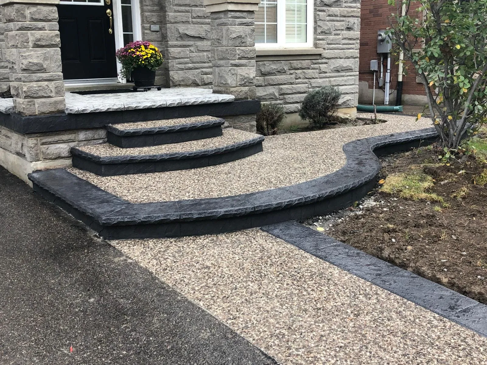 Exposed aggregate porch, steps and walkway with dark borders