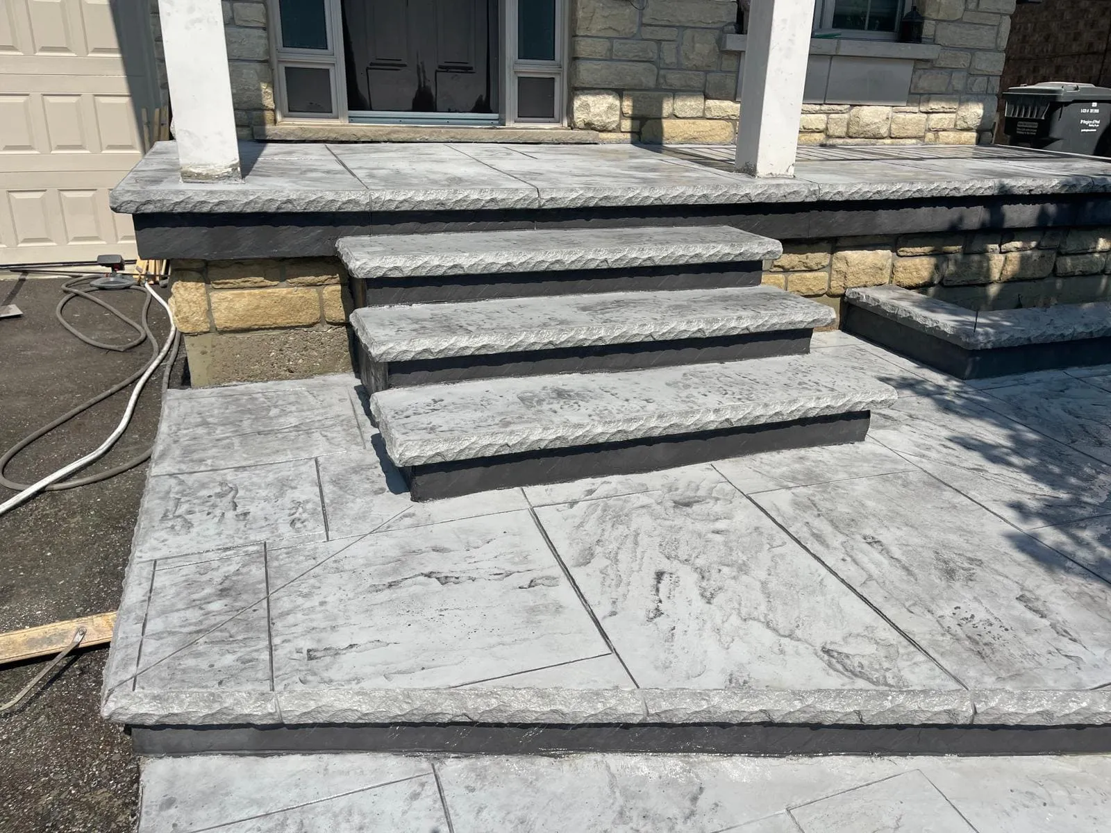 Wide stamped concrete steps and front landing