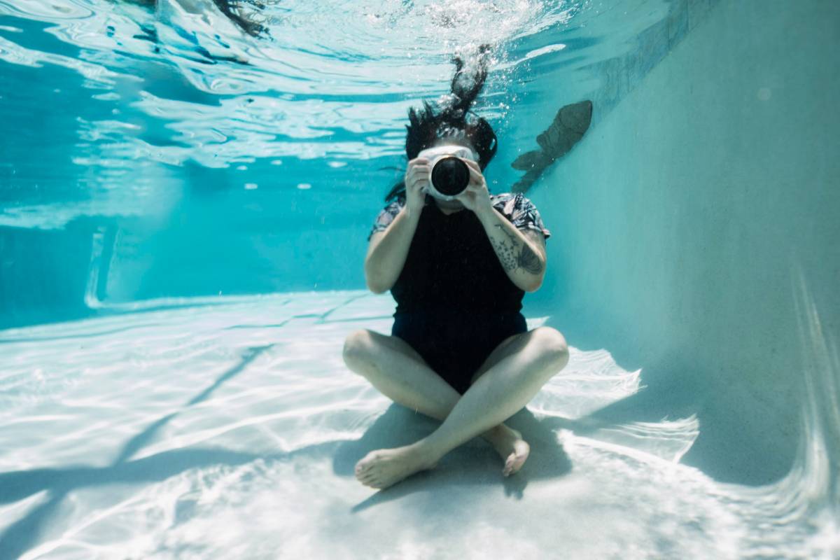 Beatrice photographing from the bottom of the pool