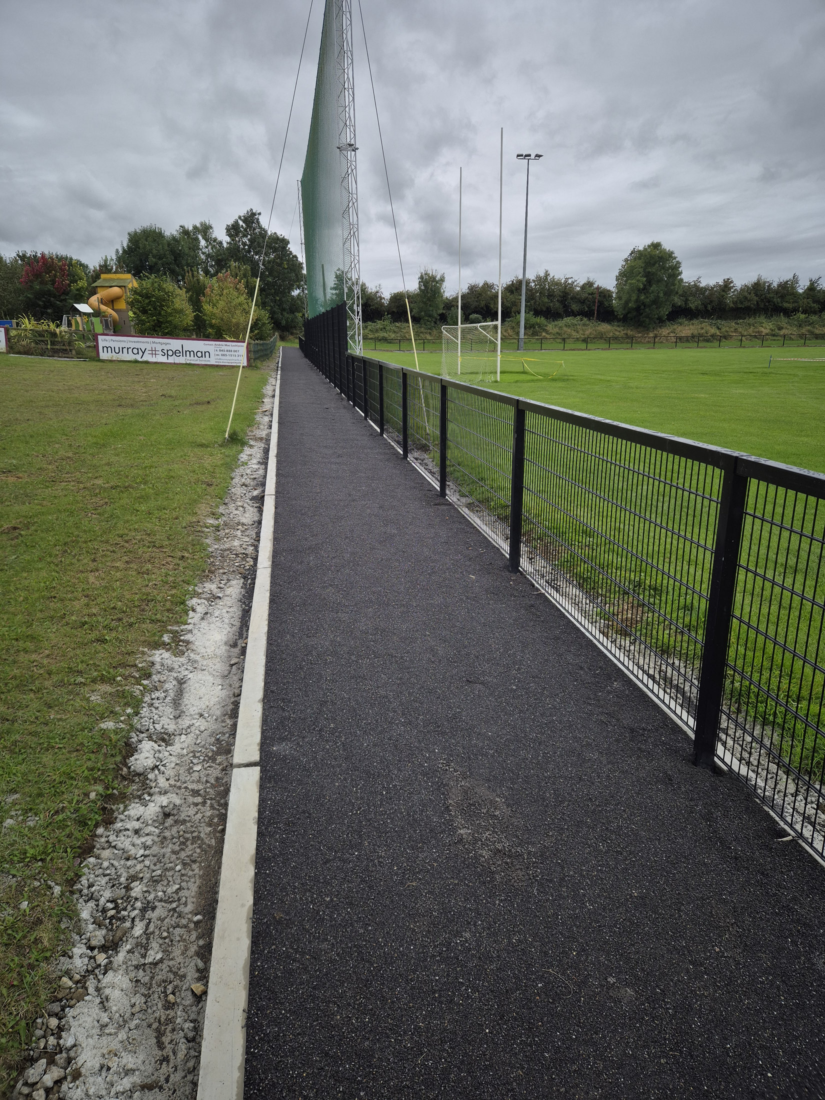 Finished perimeter path beside the pitch