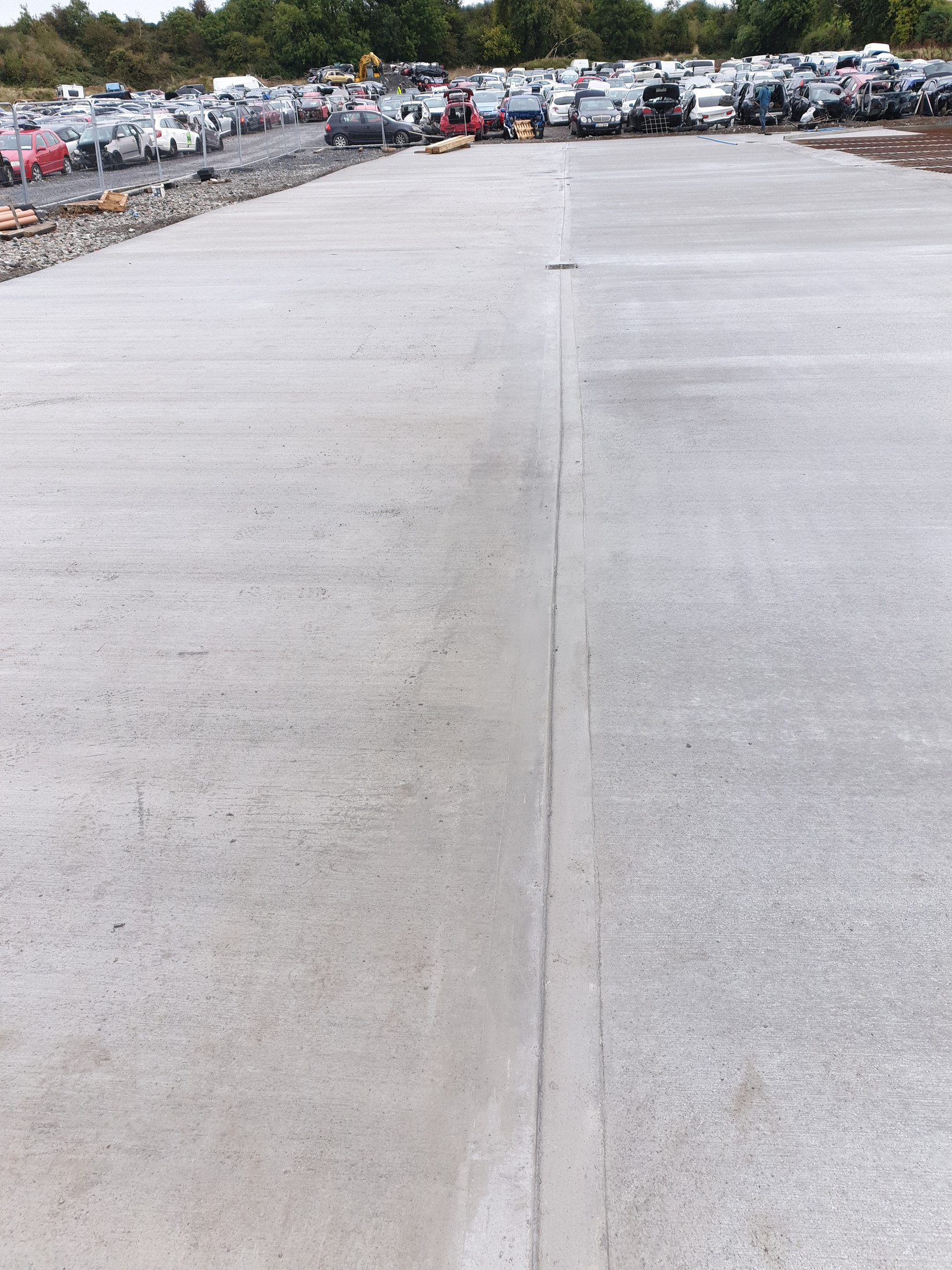 Concrete slab beside a parking area