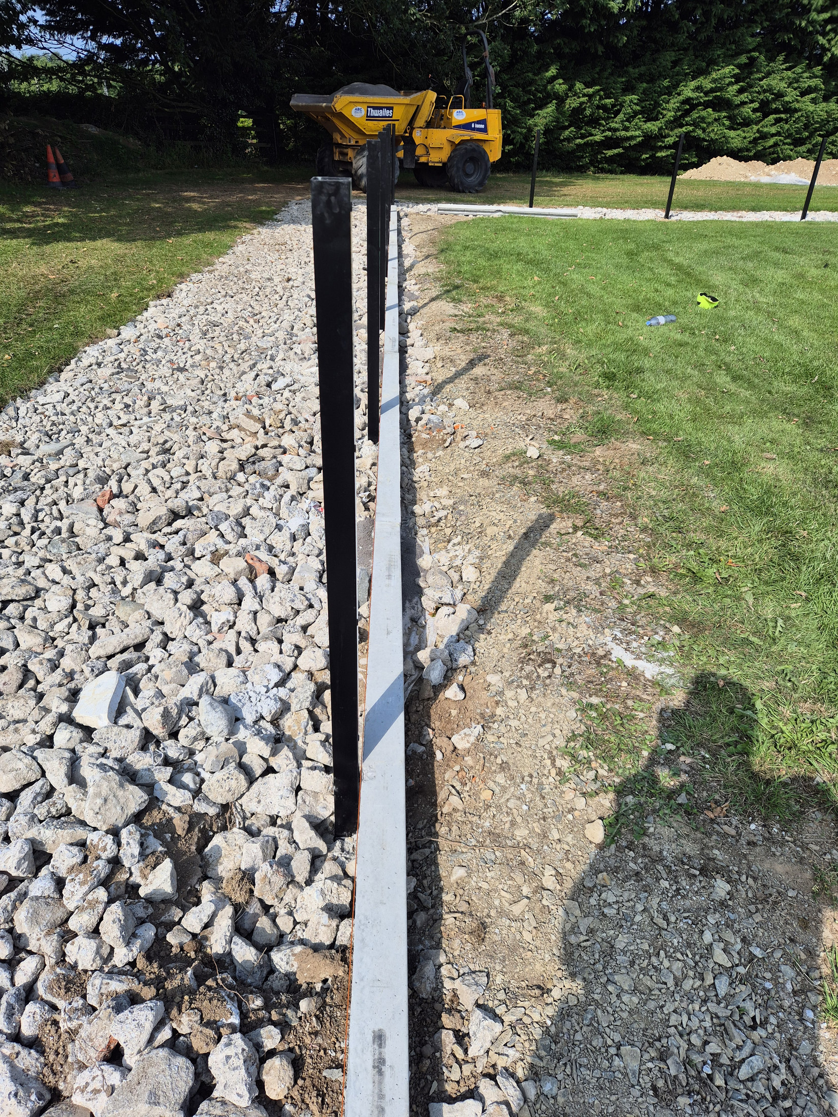 Fence post beside the stone path base