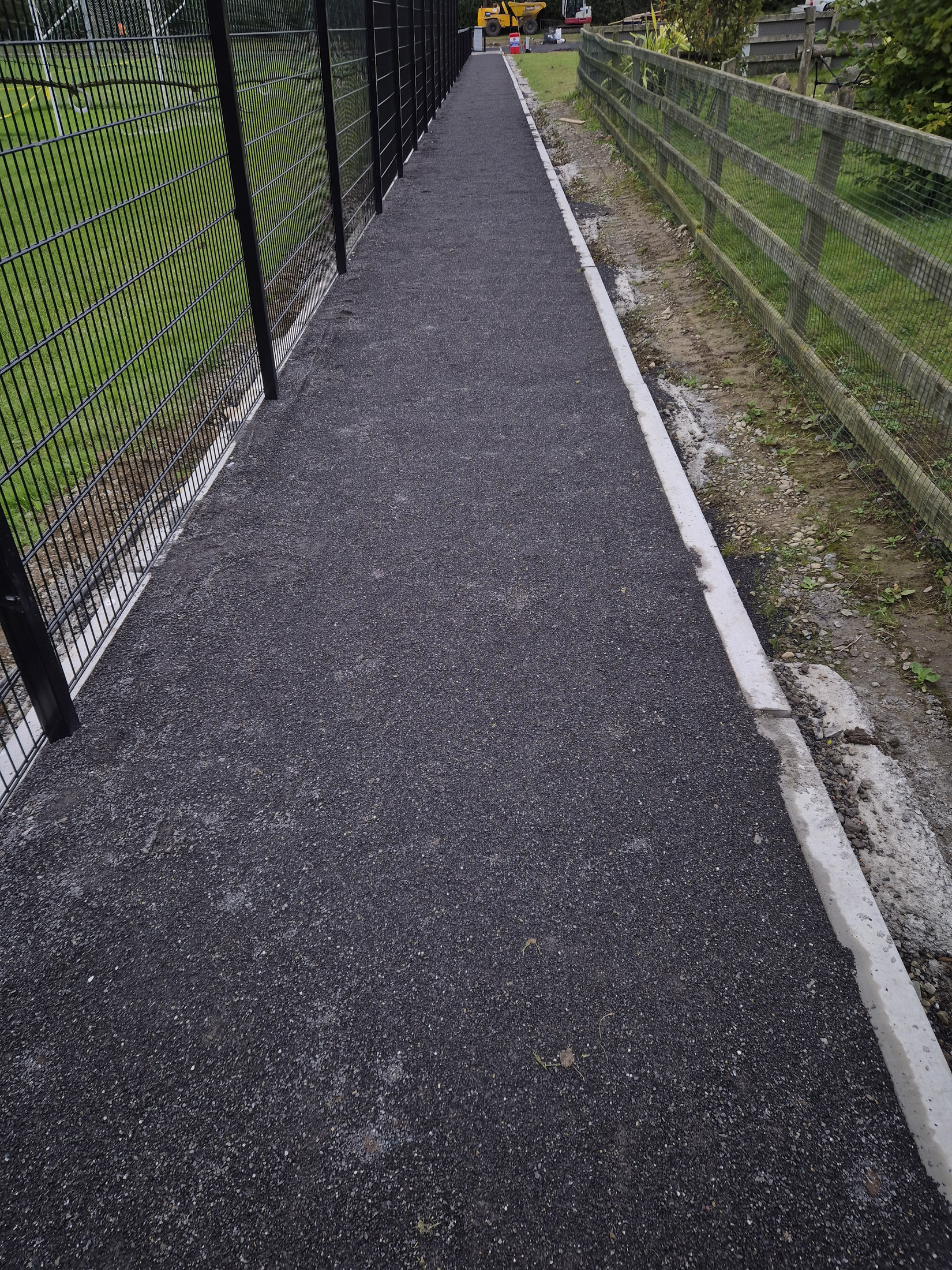 Finished perimeter path between the fences