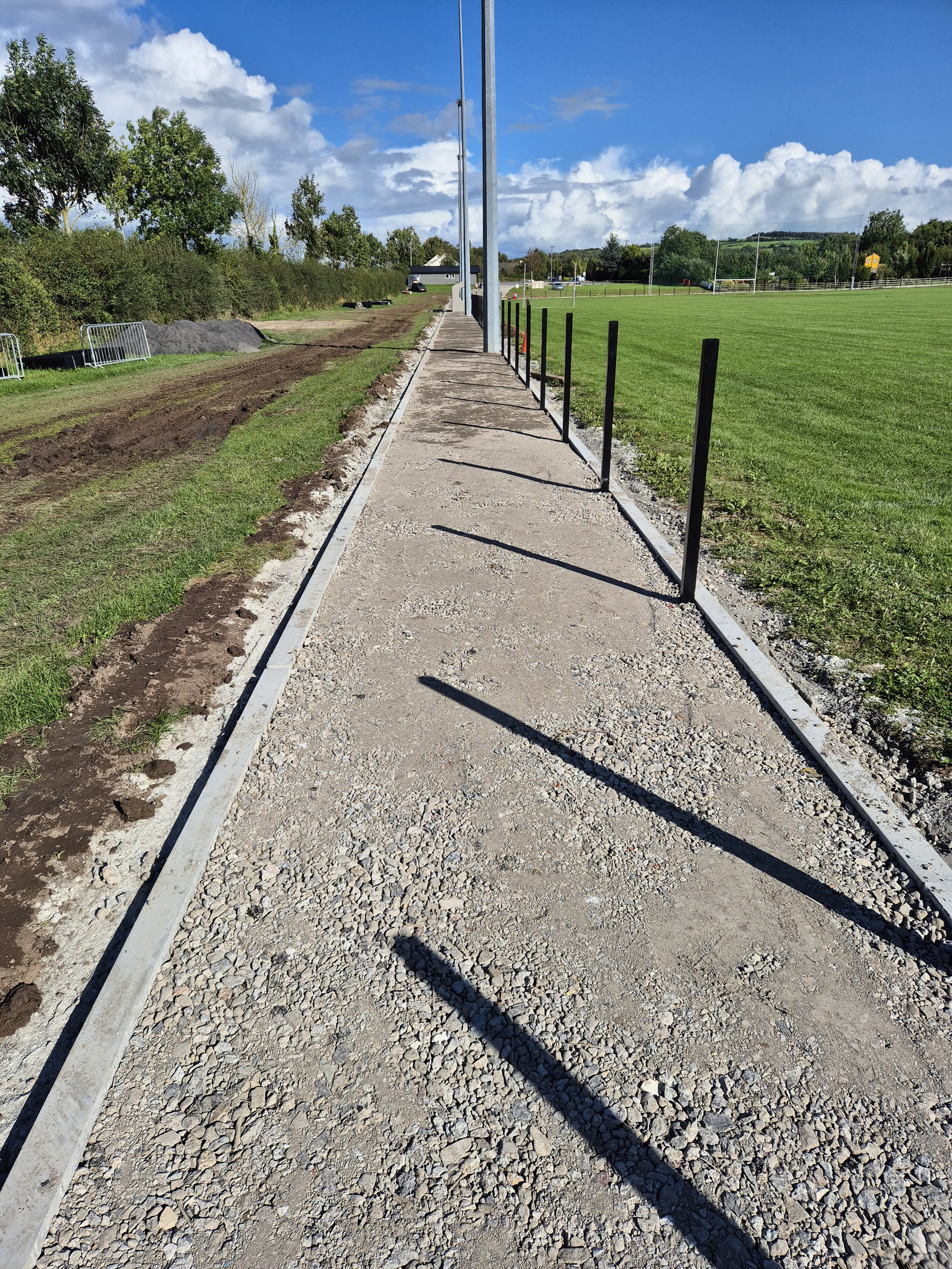 Gravel path base alongside the pitch