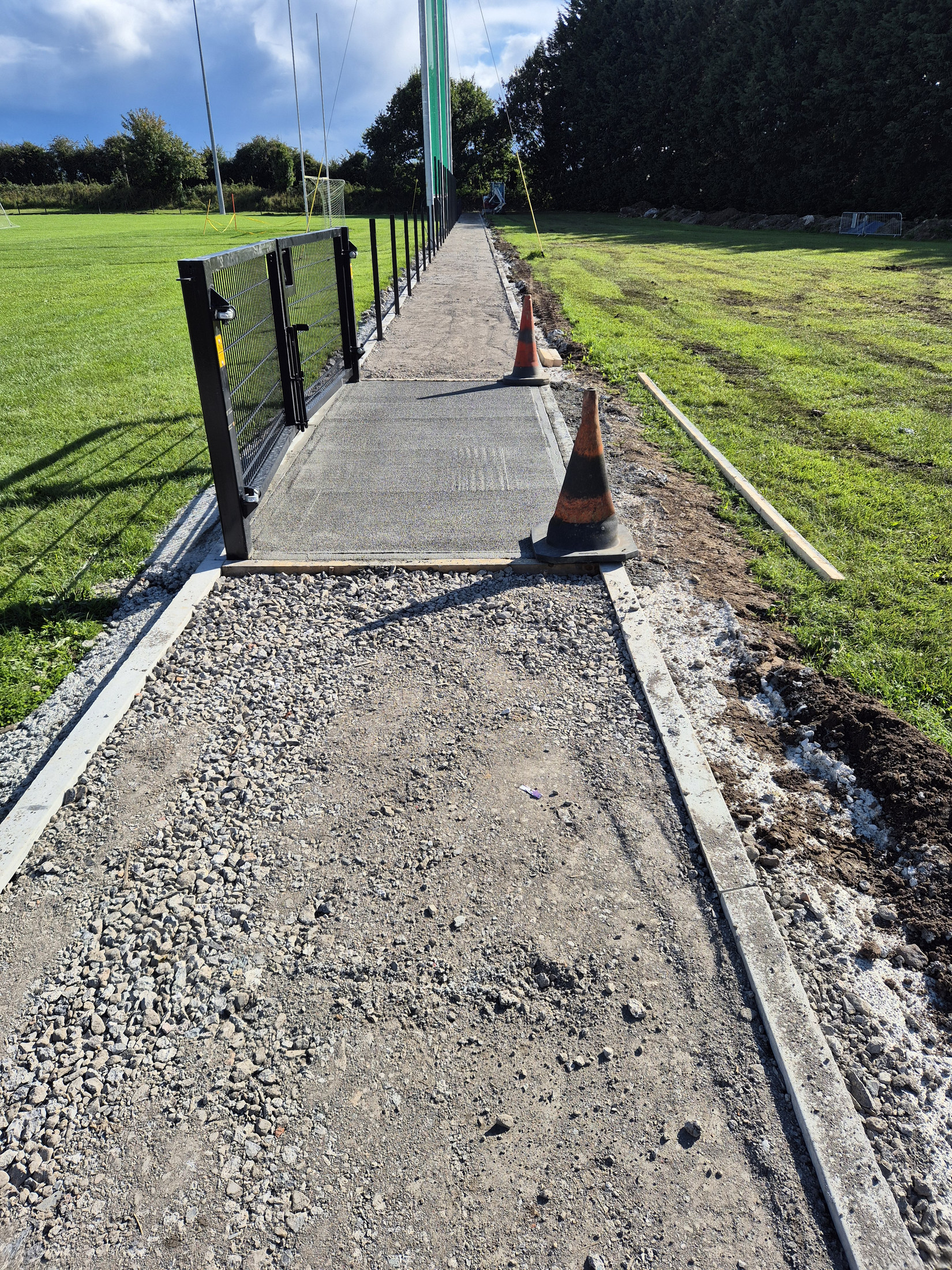 Path surface preparation beside the fence