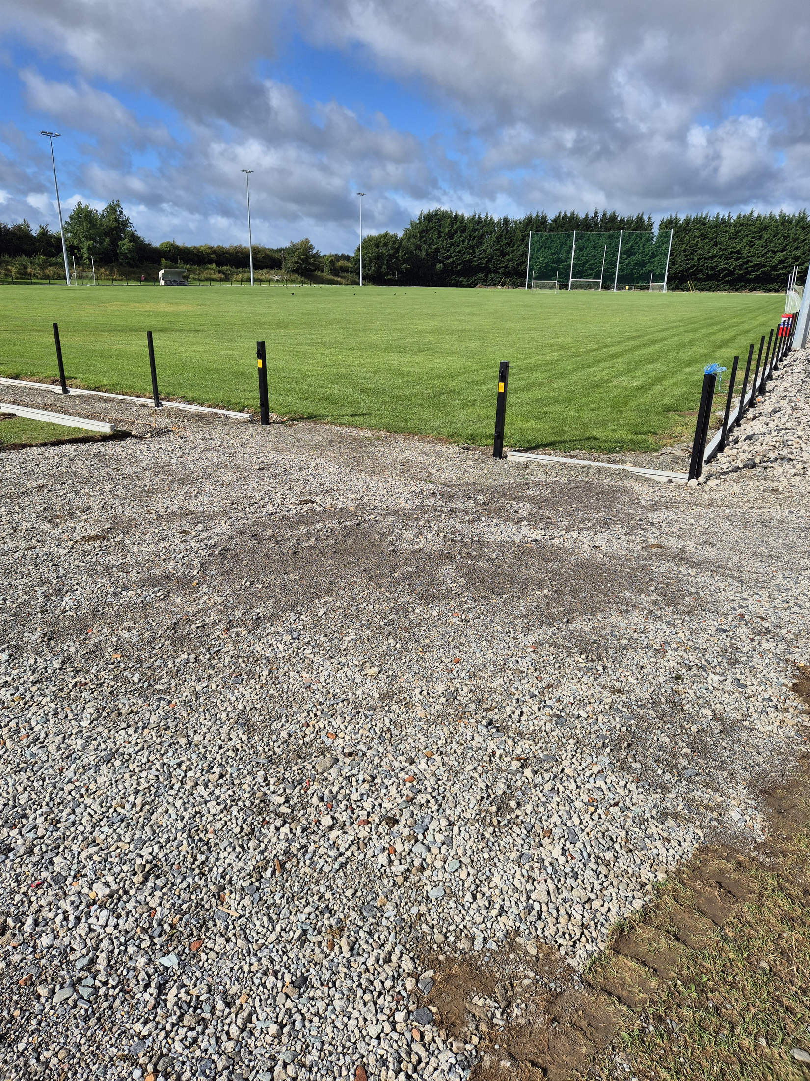 Gravel entrance beside the pitch