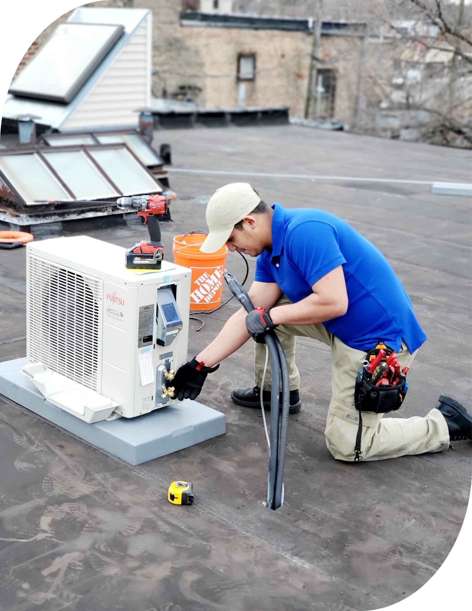 Direct Improvements technician servicing a rooftop cooling unit