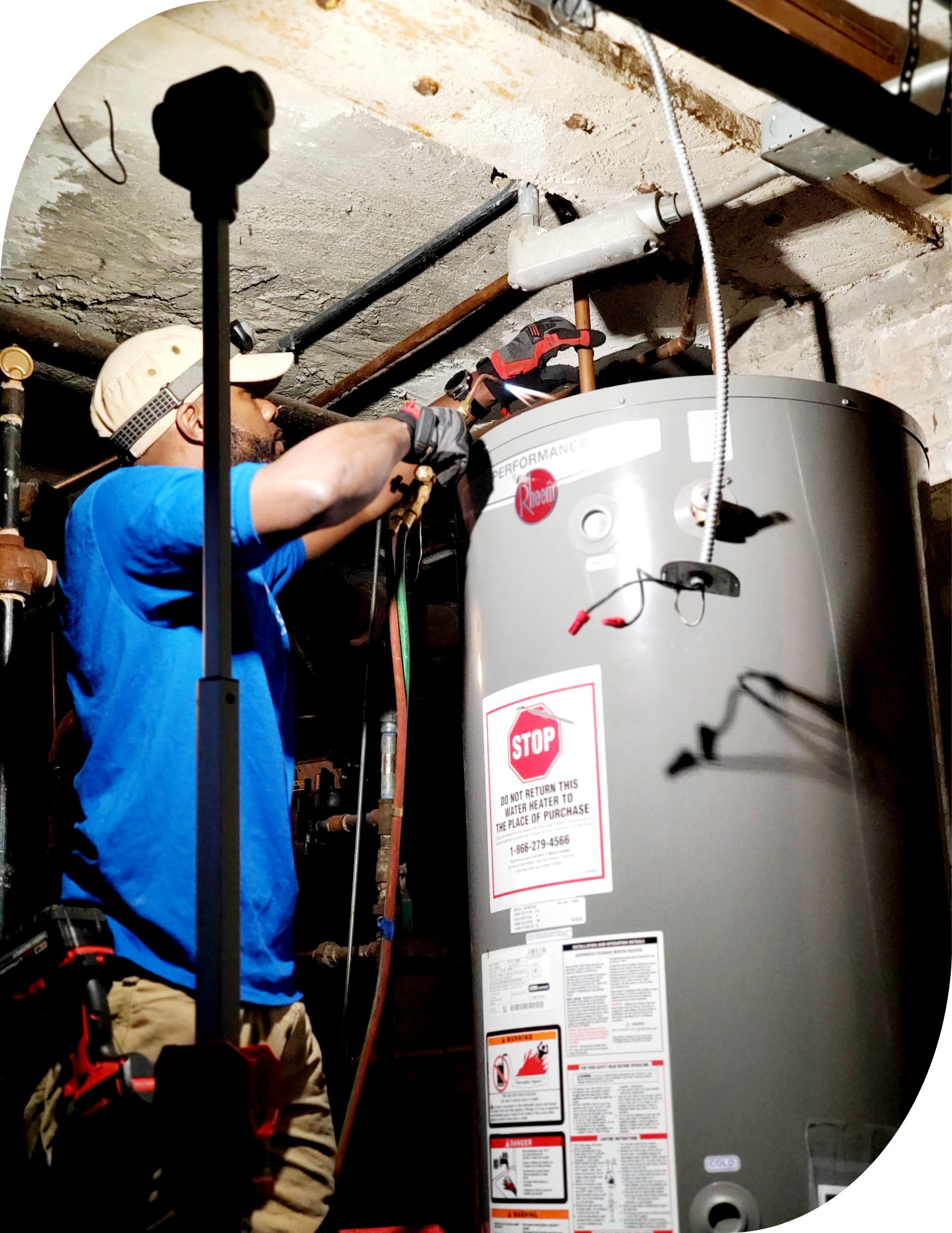 Technician servicing a residential water heater
