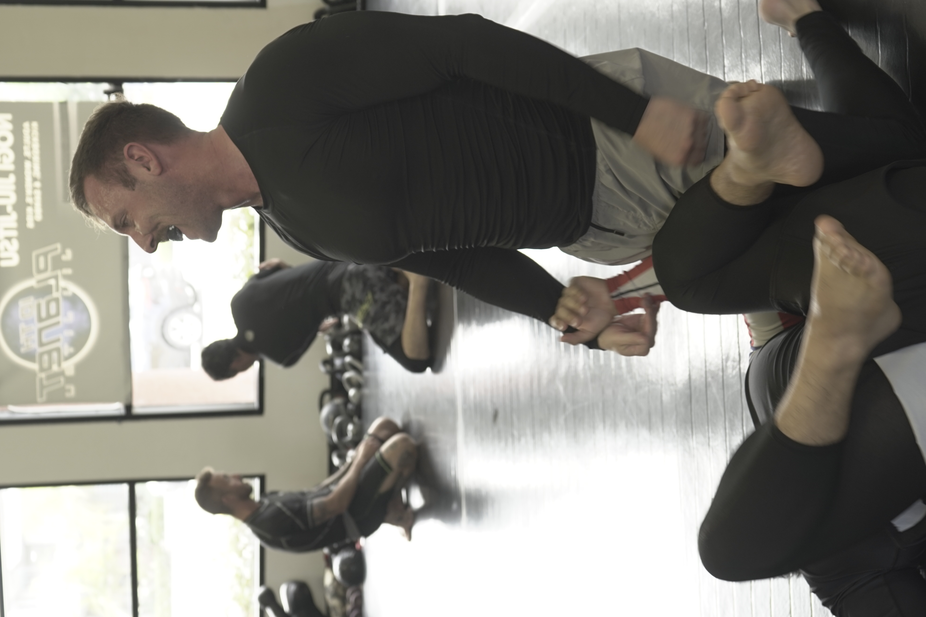 Two adult students practicing No-Gi Jiu Jitsu Two adult students practicing No-Gi Jiu Jitsu