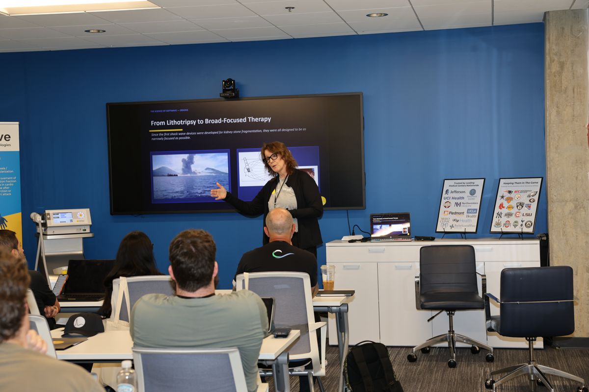 Instructor leading a classroom session on the science of SoftWave
