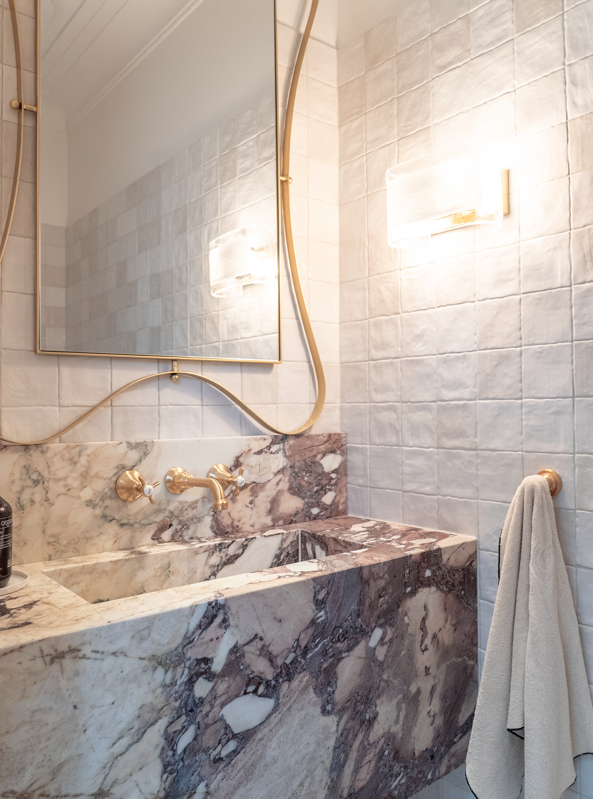 Bathroom renovation Melbourne marble vanity with mirror and lighting