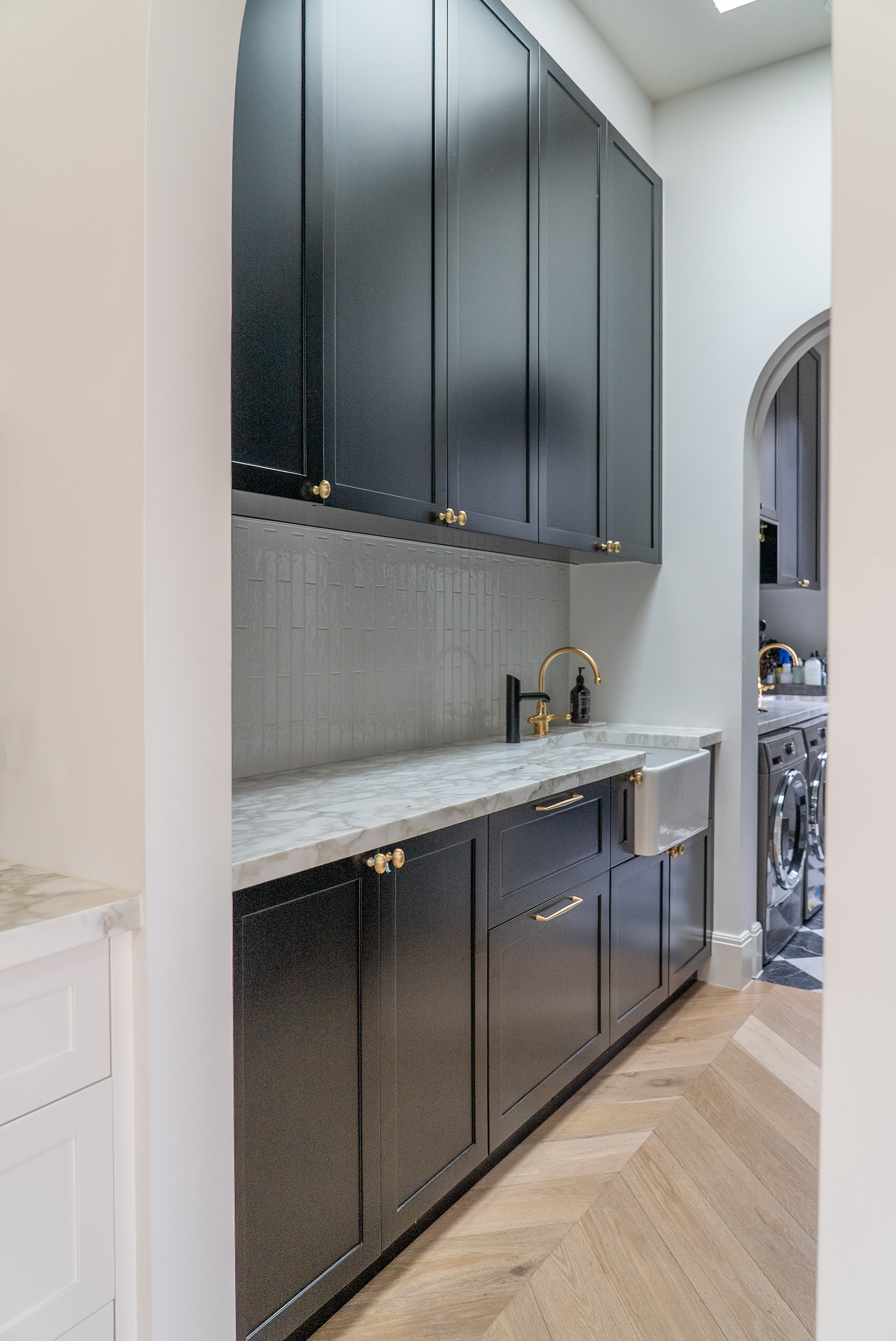 Kitchen renovation Melbourne dark cabinetry with marble benchtop
