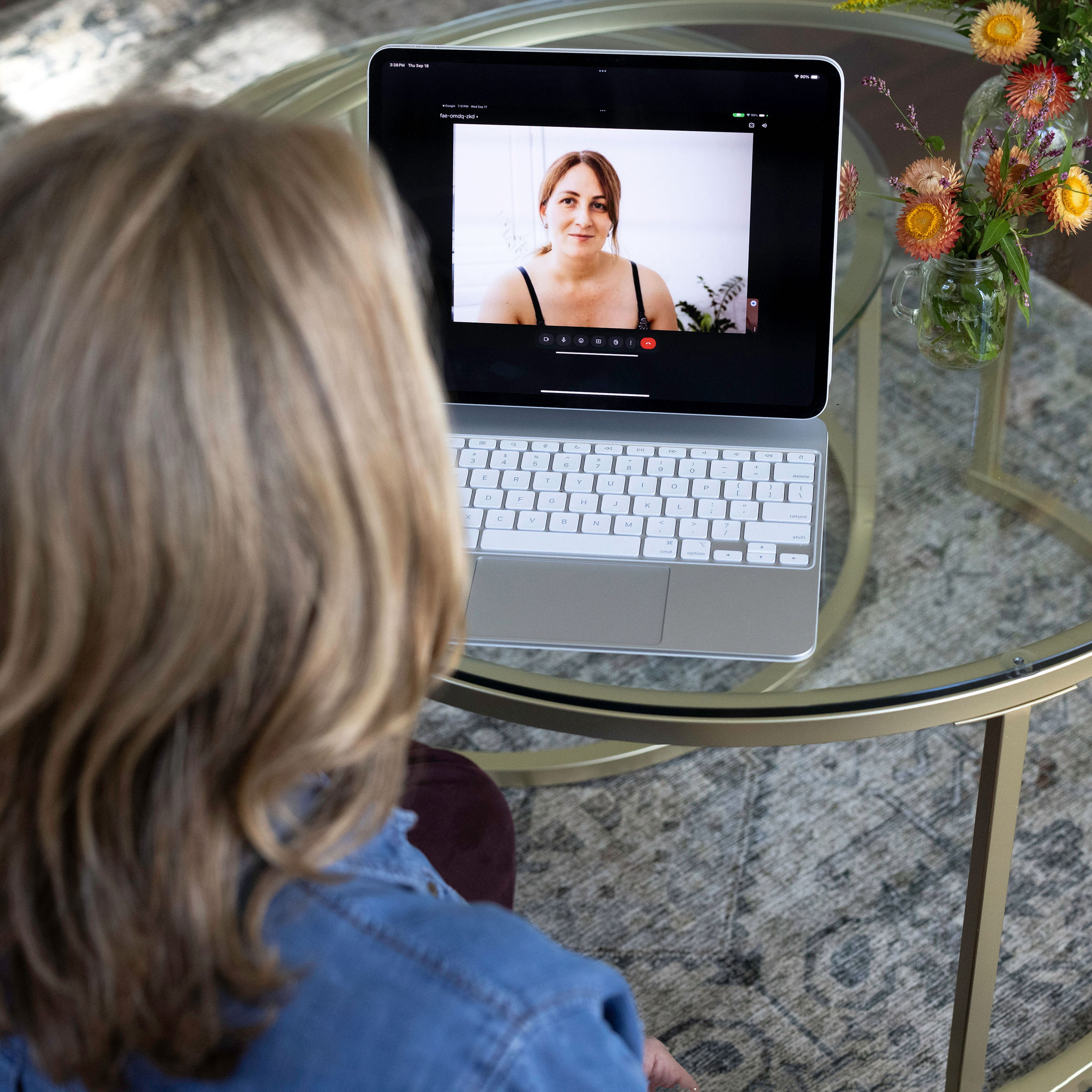Woman participating in an online health coaching session from home.