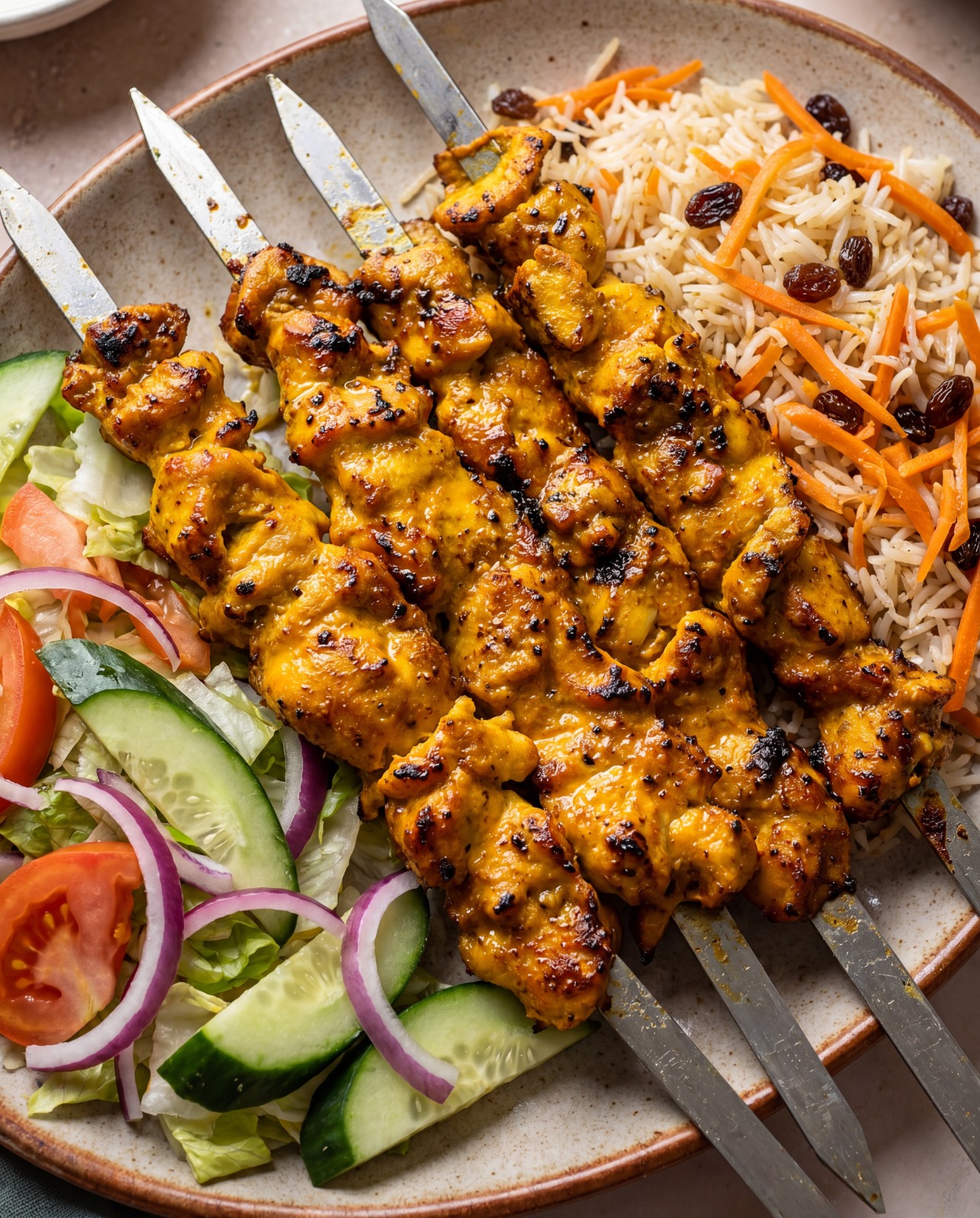 Afghan chicken kebab grilled over charcoal, served with crisp salad and fresh Afghan bread