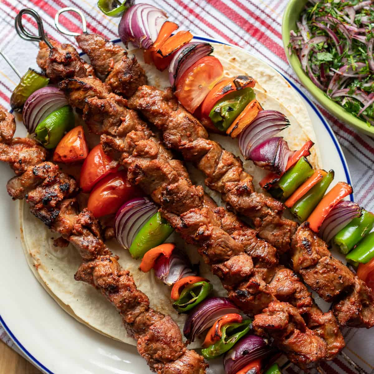 Charcoal-grilled Afghan lamb kebab skewers