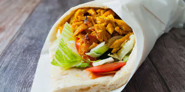 Charcoal Kebab Roll wrapped in Afghan bread with salad and house sauces