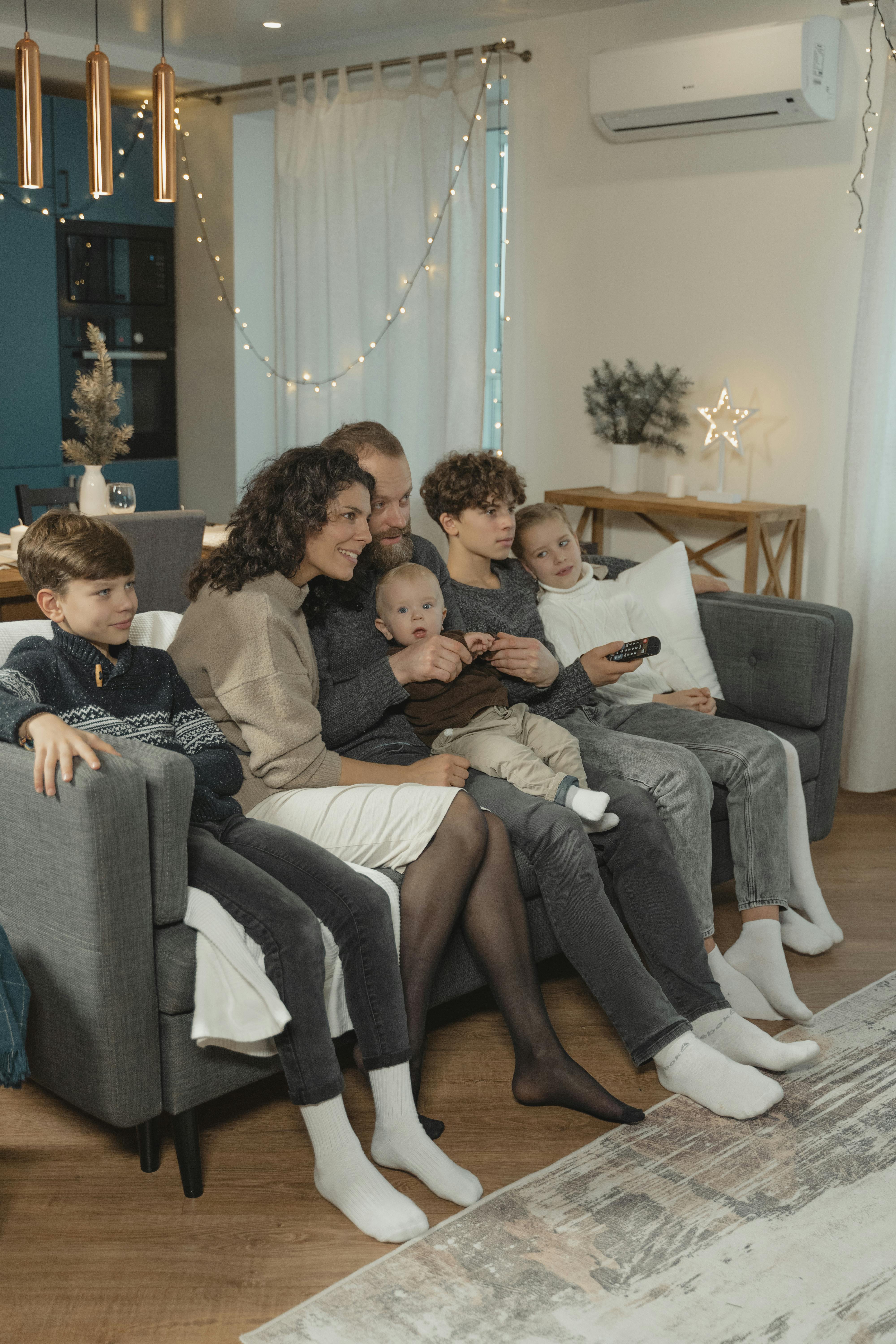 Family relaxing comfortably at home with ductless mini-split AC โ Flex Mechanical Orange County