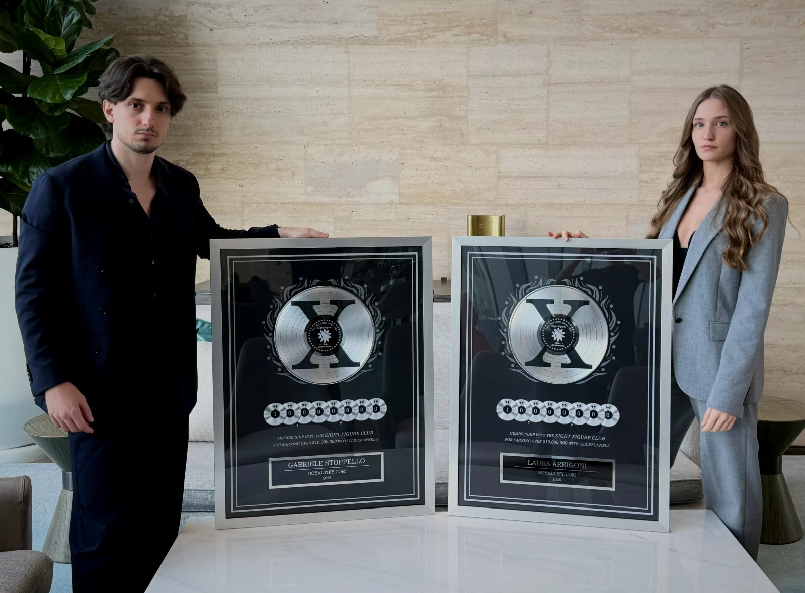Gabriele Stoppello and Laura Arrigoni with their ClickFunnels Eight Figure Club awards