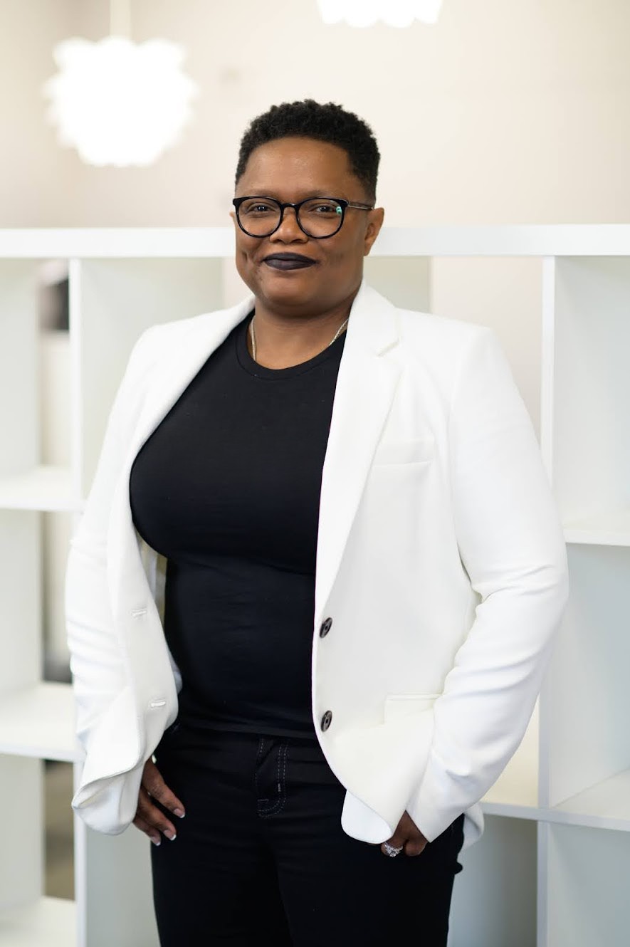 Tia A Williams | Principal Systems Architect standing in an office space