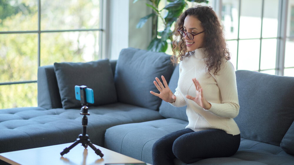 Woman recording a video on her phone