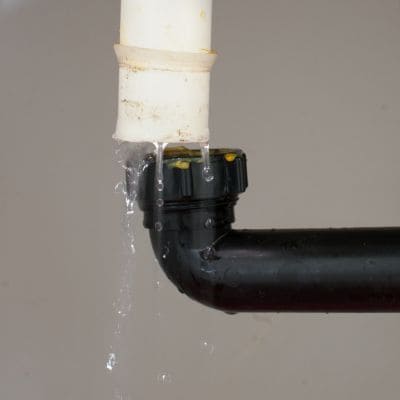 Close-up of a leaking pipe joint needing repair