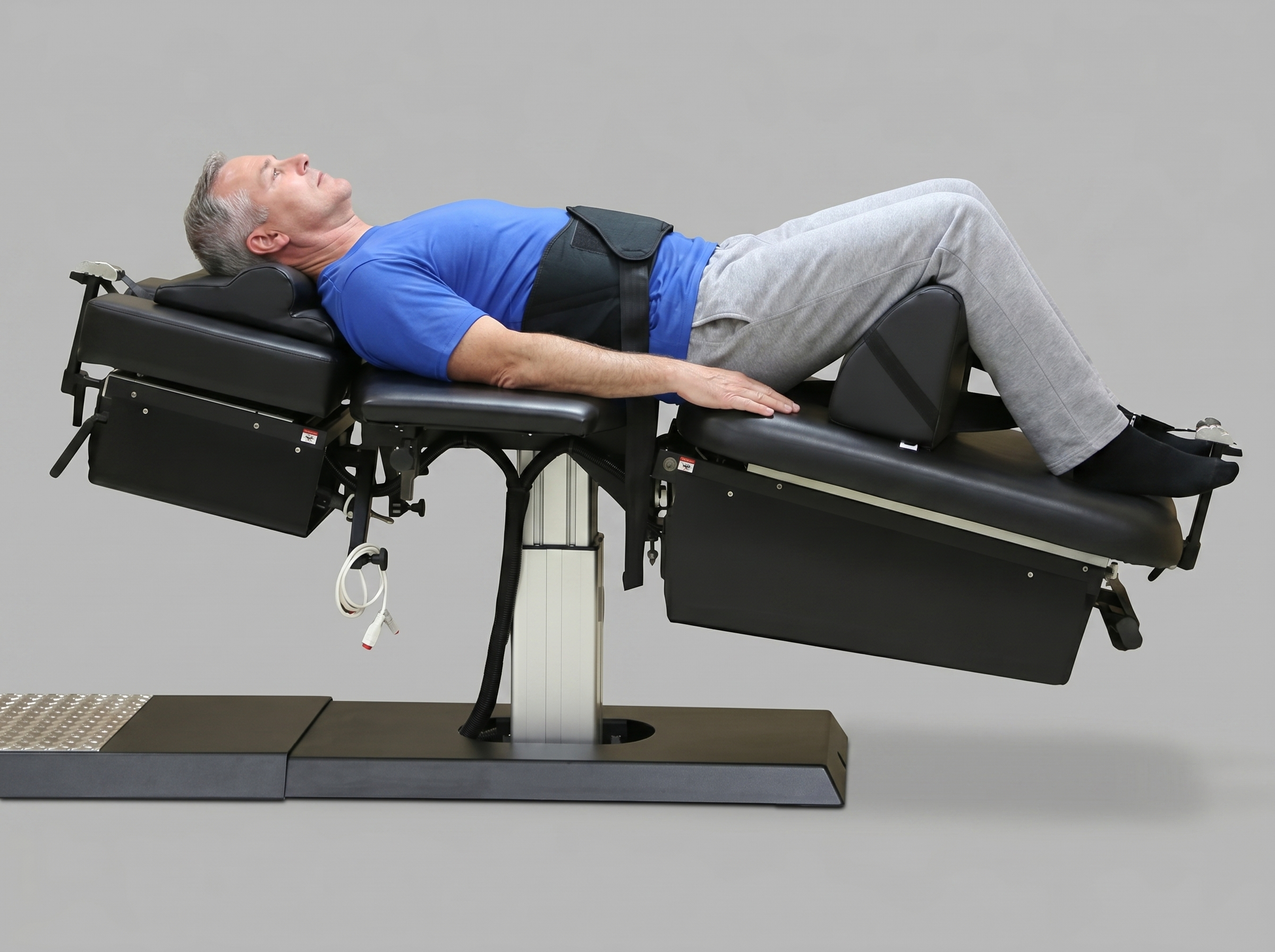 Patient receiving spinal decompression therapy for a pinched nerve