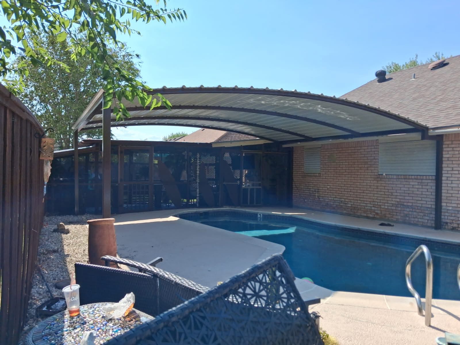 Curved steel poolside patio cover by Exodus Structures