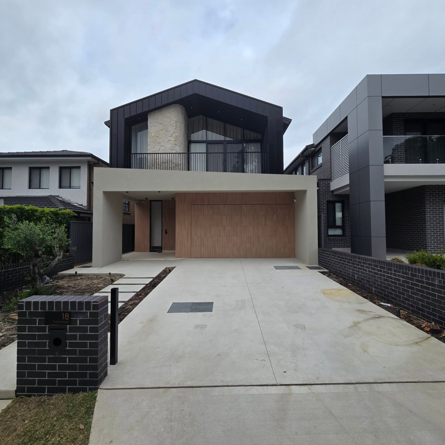 Jet Black Concrete with a Sandy Beige Fleck Finish