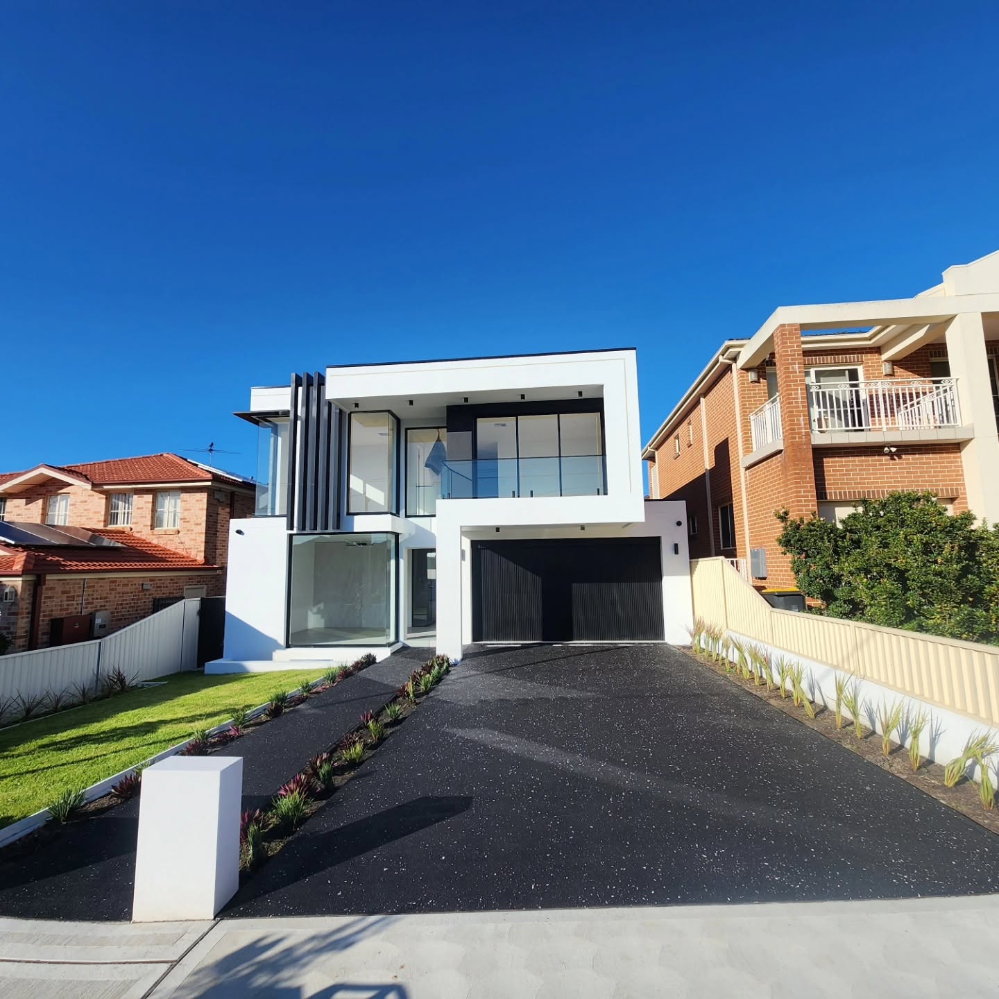 Jet Black Driveway with a Crisp White Fleck Finish