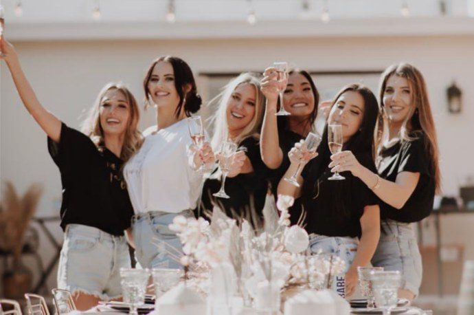 Friends raising a toast at a bridal shower