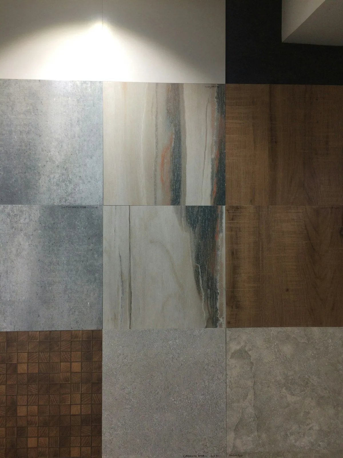 Large-format stone-look floor and wall tiles in grey and brown