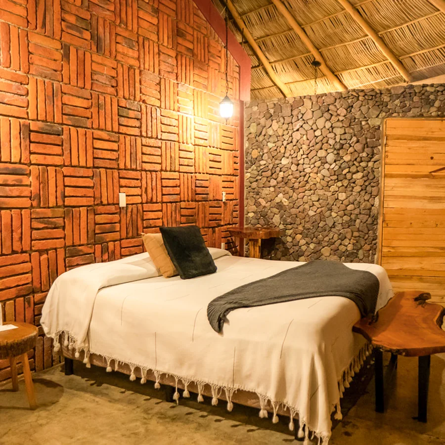 A king room under a thatched roof