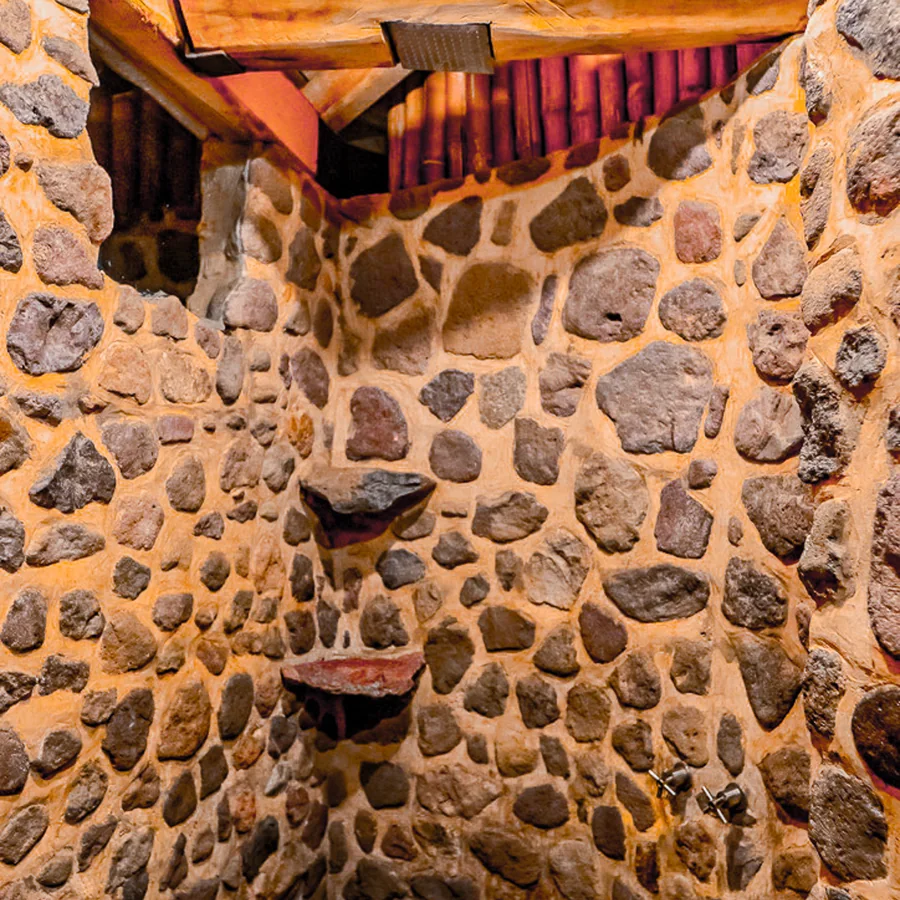 A shower built entirely from river stone