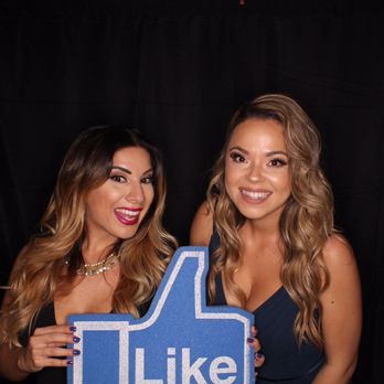 Professional photo booth attendant managing booth at event