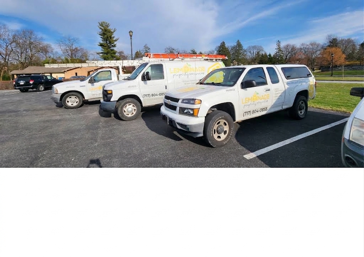 The Lemonade Property Services fleet of work trucks and vans
