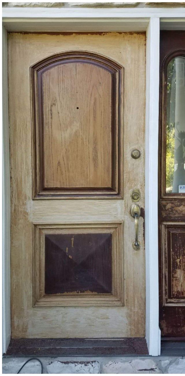 Worn, peeling front door before