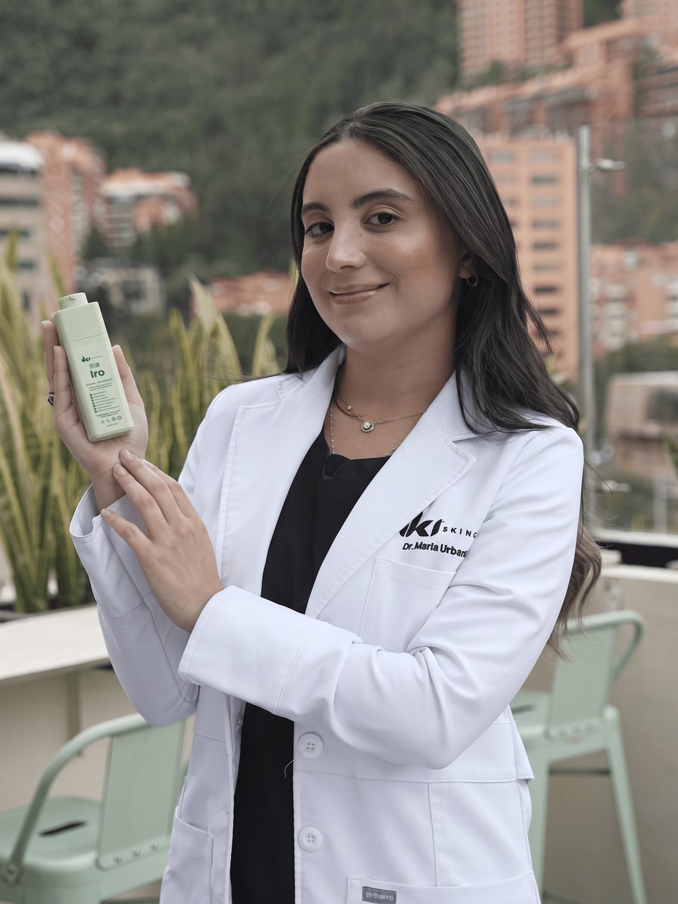 Dr. M. Urbani, MD, founder of IKI, holding Iro Emulsion Gel Moisturizer