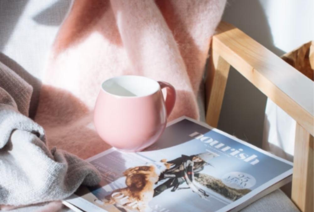 magazine, coffee, and blanket