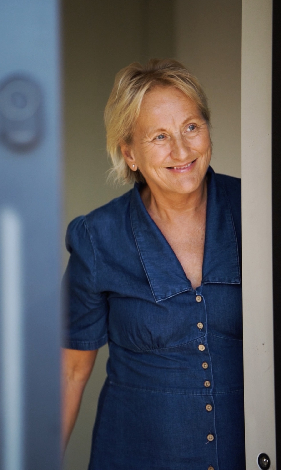 Mowatt welcoming a client at the door