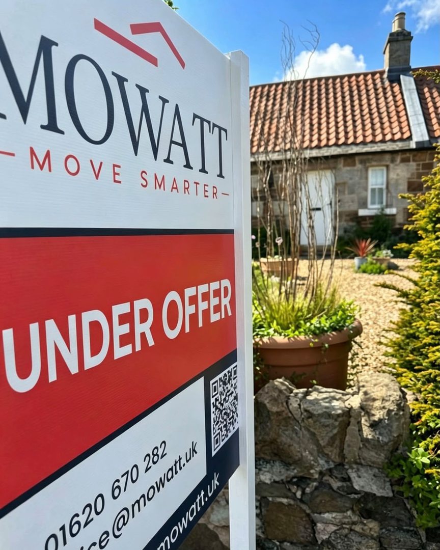 Mowatt Under Offer sign at a stone cottage